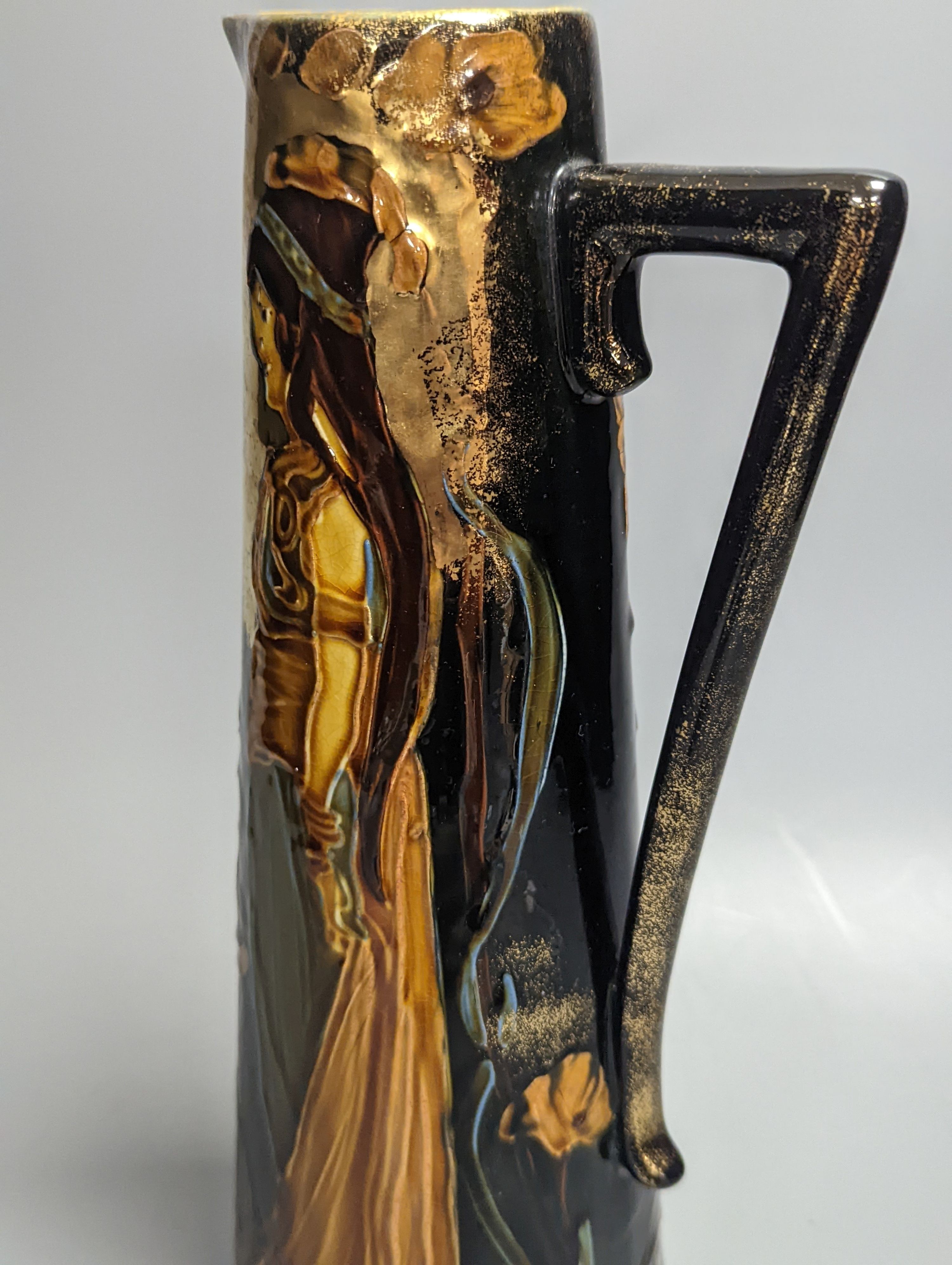 An Art Nouveau earthenware tapering jug, height 30cm